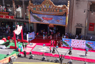 Workers prepare the red carpet for the Planes premiere